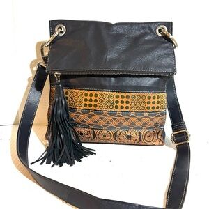 Elegant Black and Tan Crossbody Bag with Tassel